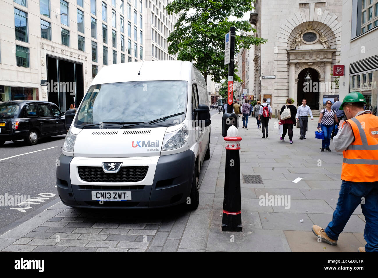 A UK Mail Delivery Vehicle Parked In The Street In The City Of London 