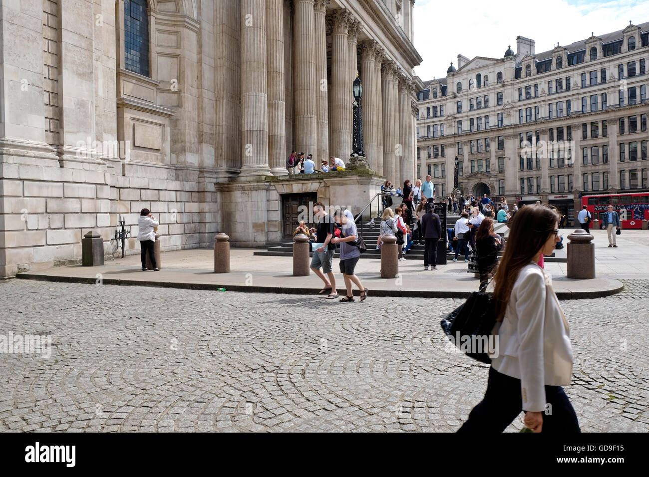 Tourist outside St Paul's Cathedral a London landmark Stock Photo
