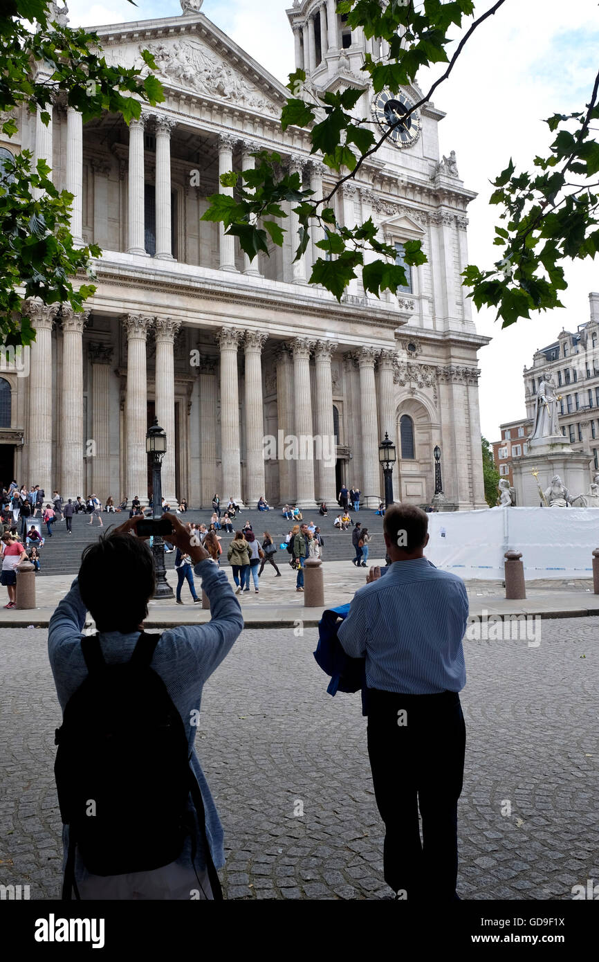Tourists outside St Paul's Cathedral a London landmark Stock Photo