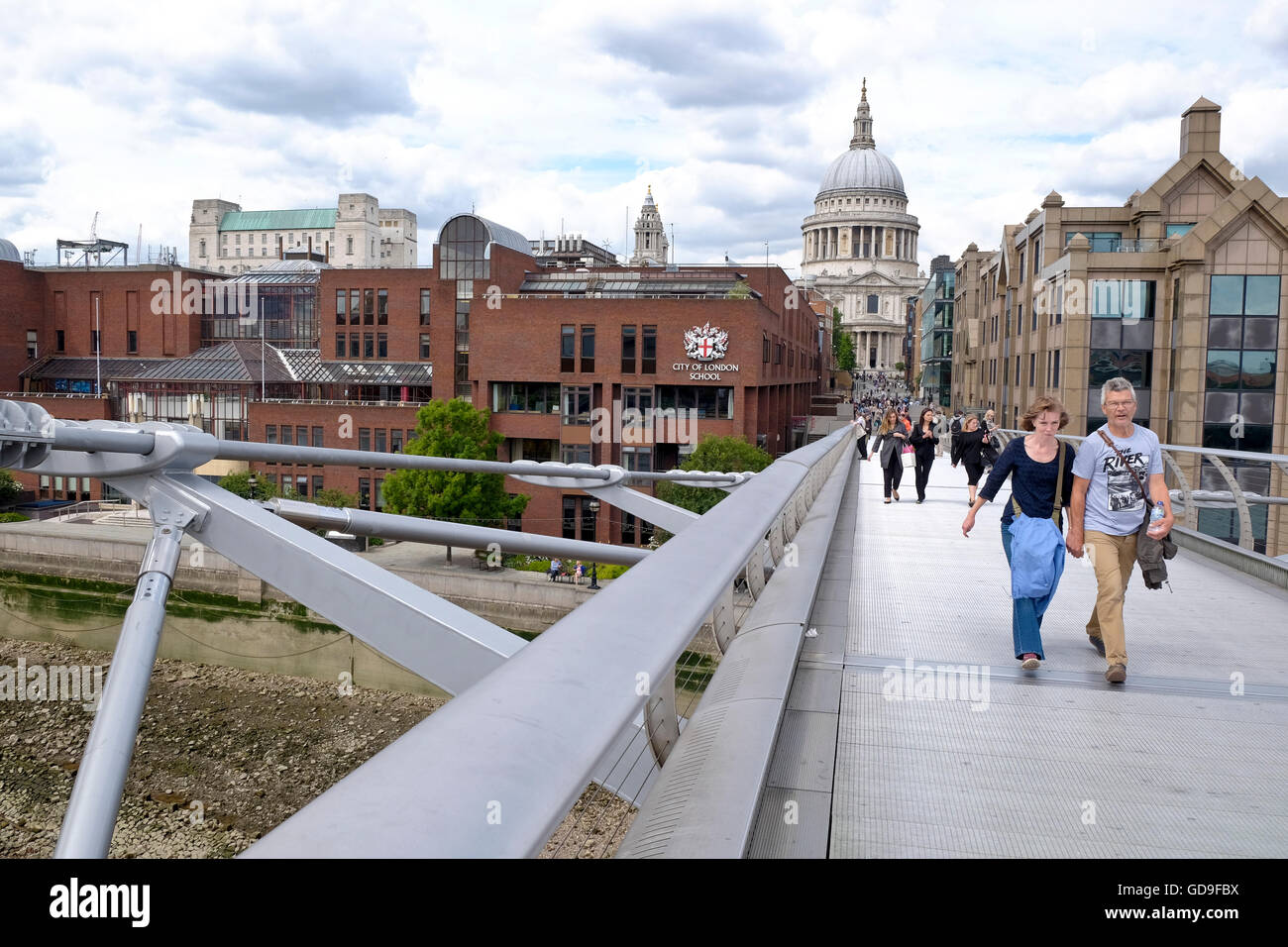 London, United Kingdom. St Paul's cathedral a London landmark from the Millennium Bridge which crosses the Thames river Stock Photo