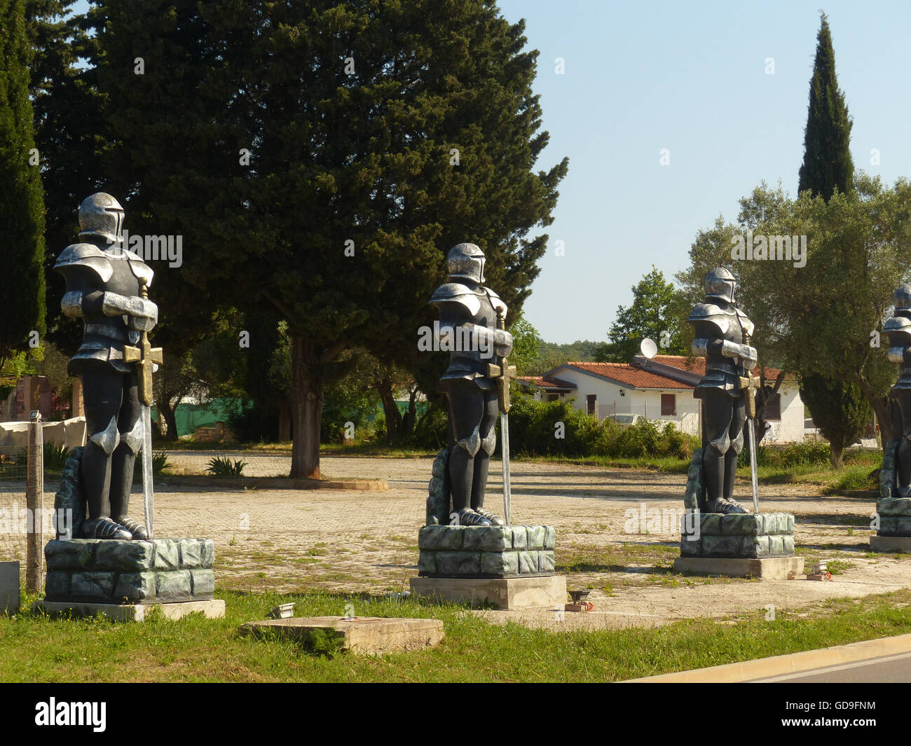 fake statues of Crusaders in front of defunct restaurant,Rovinj,Croatia