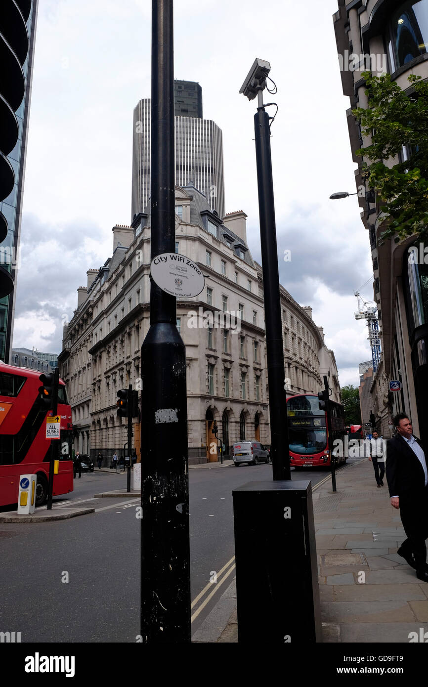 London United Kingdom. A wifi zone advisory notice on a post in the City of London with Tower 42 in the background Stock Photo