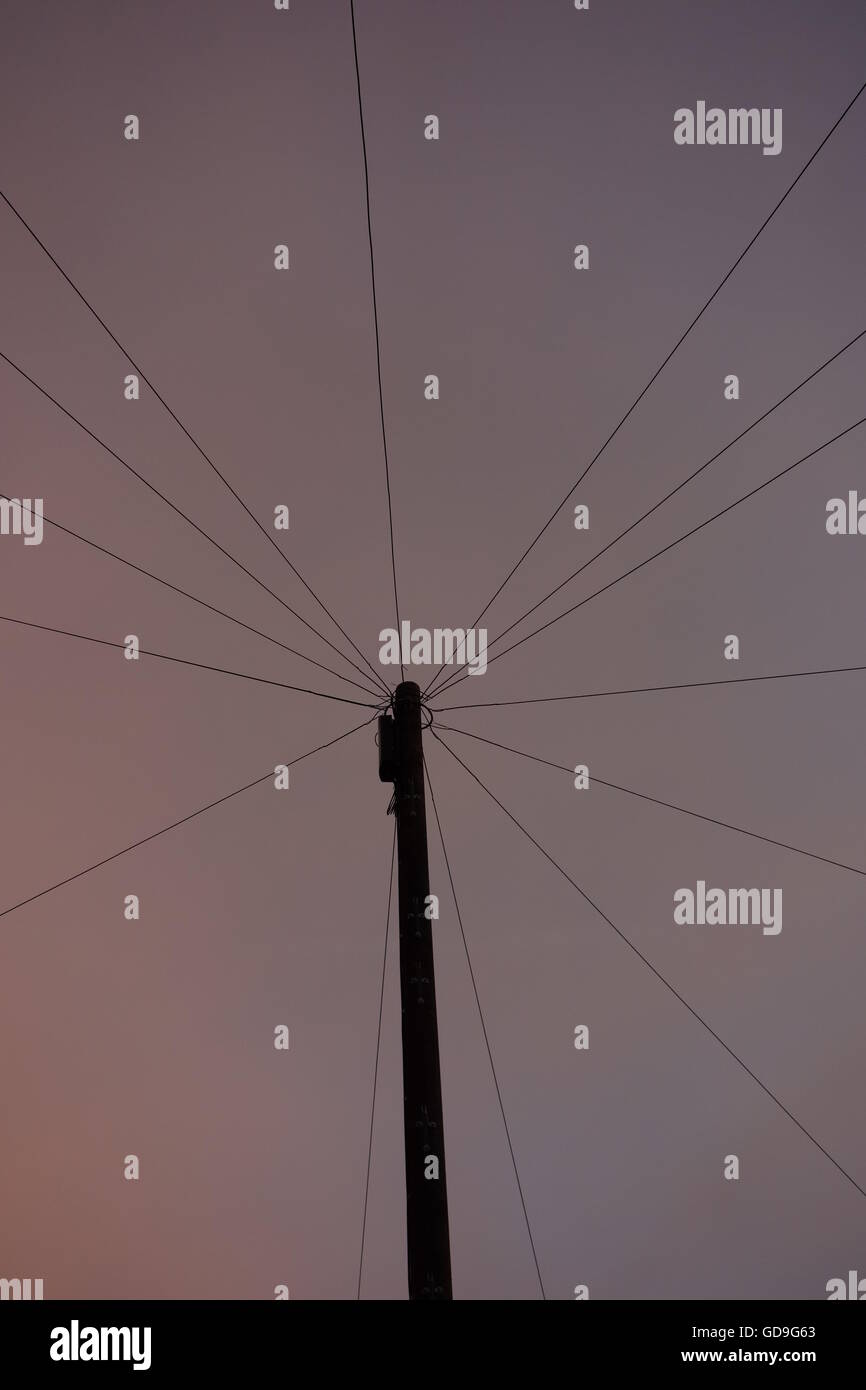 Telephone pole and lines against sunset sky Stock Photo Alamy