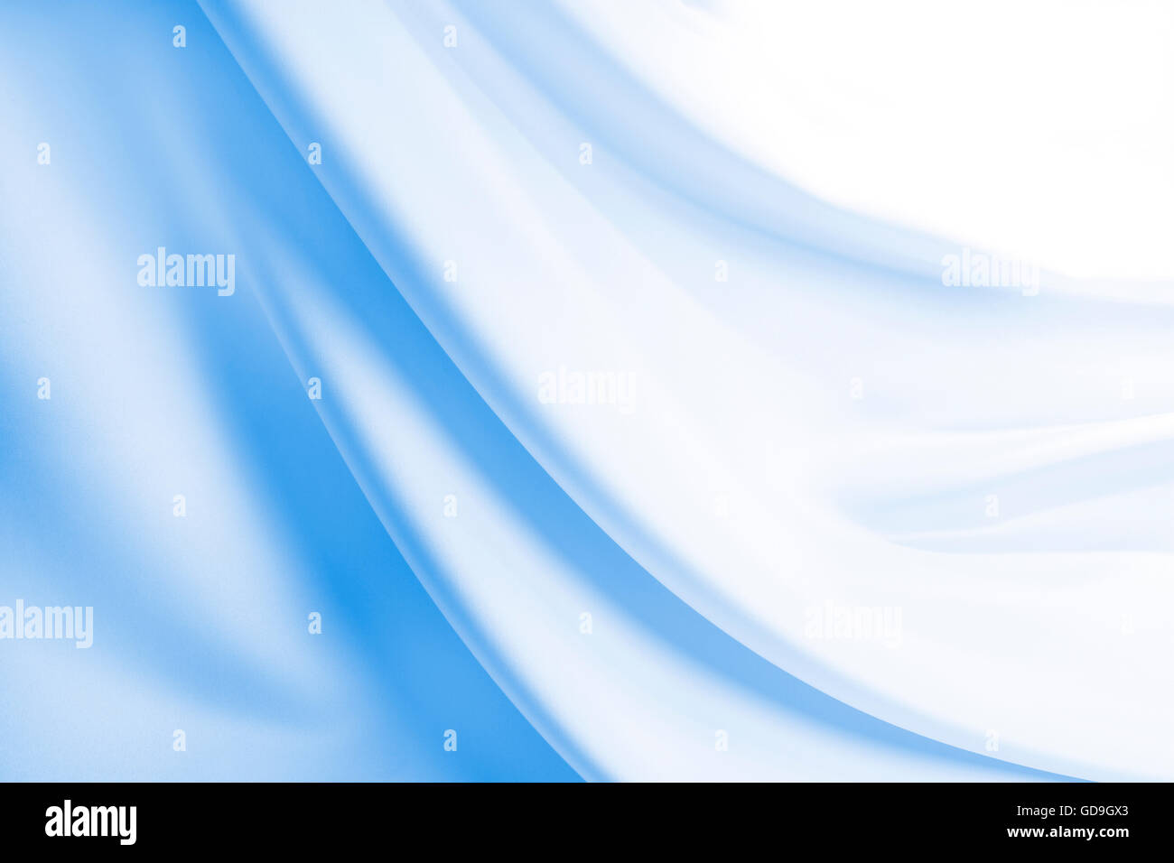 Folds in silky blue fabric hi-res stock photography and images - Alamy