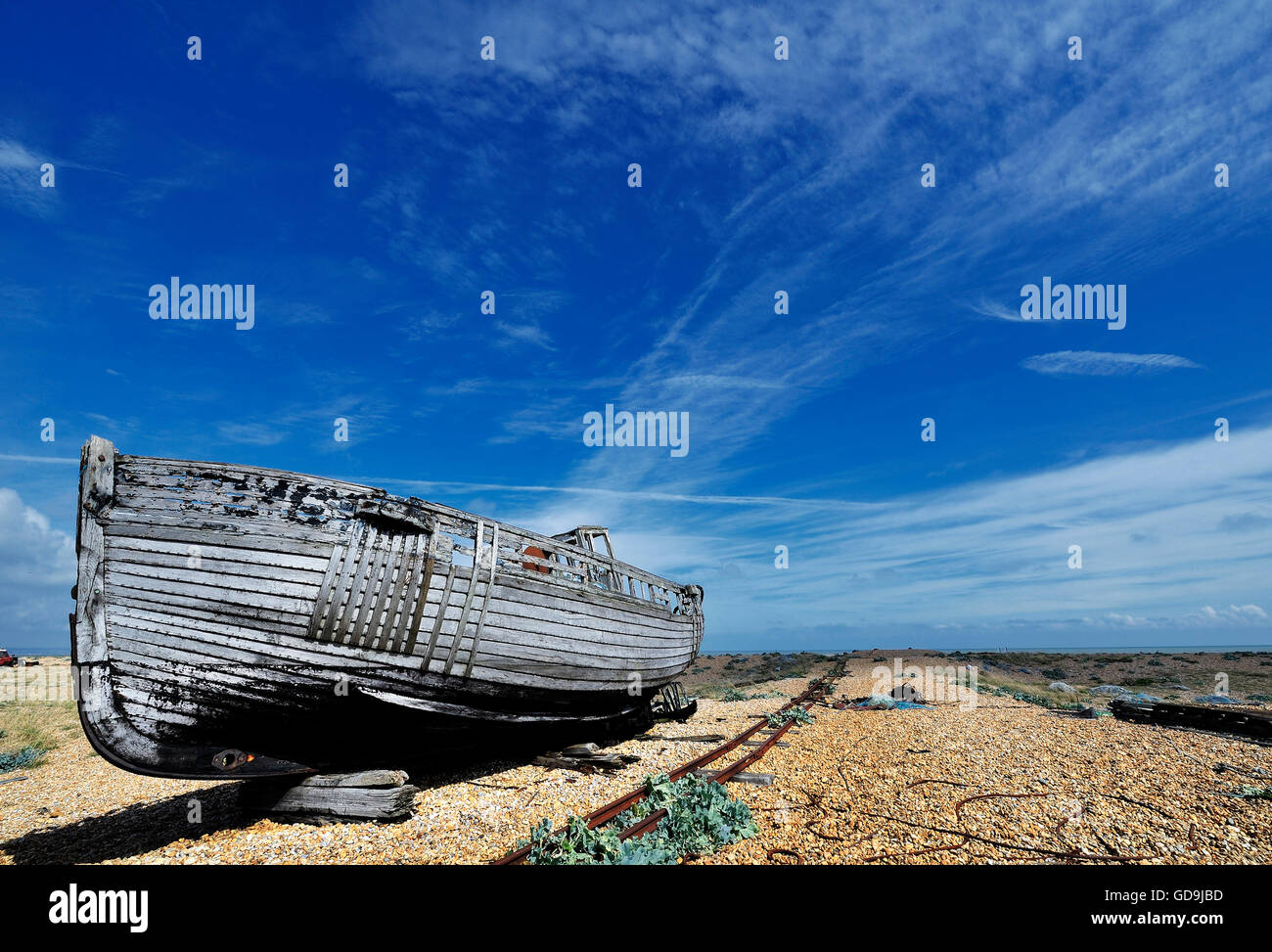 An old and disused fishing boat at Dungeness on the coast of Kent ...