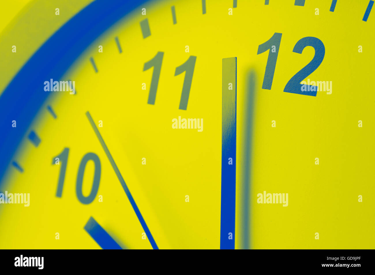 Closeup of hands on clock face Stock Photo Alamy