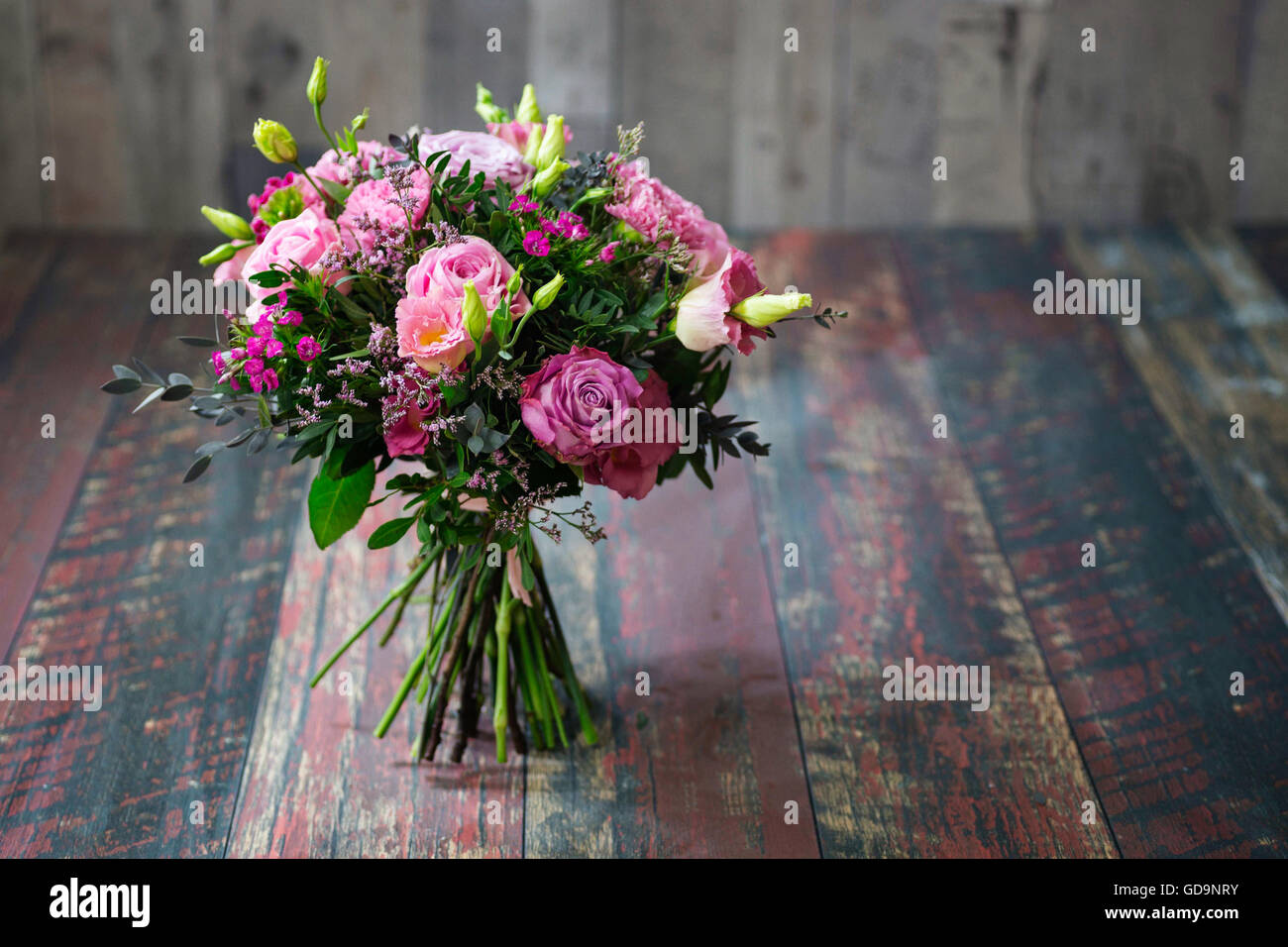 Rustic Wedding Bouquet For Bride Or Bridesmaid Made With Roses Carnations Daisies Tulips And Lisianthus Flowers In Different Shades Of Pink Stock Photo Alamy