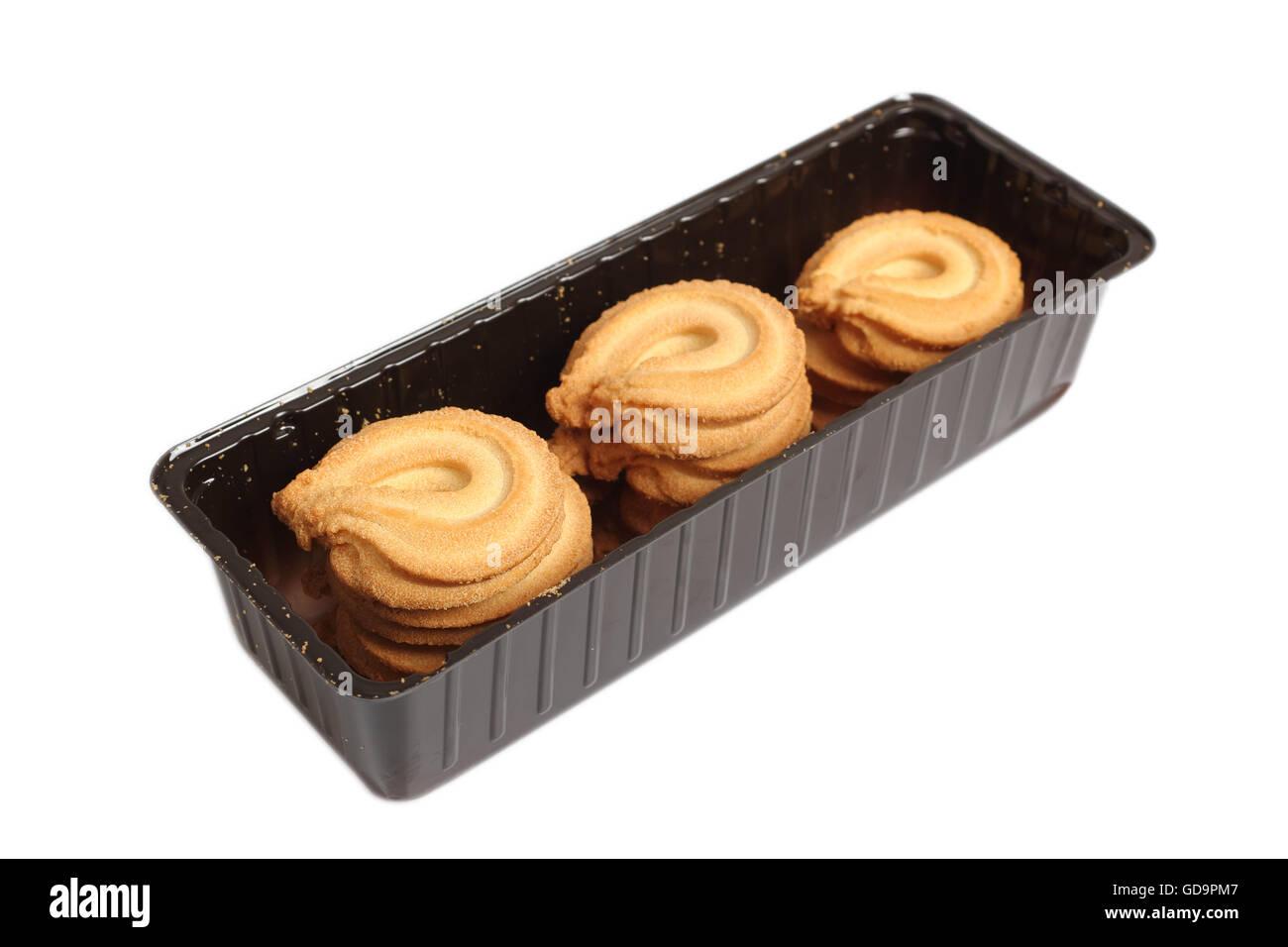 Butter cookies in disposable plastic packing box. Isolated with