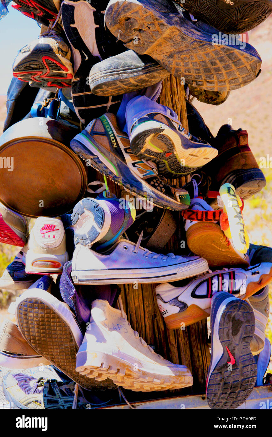 Shoes hanging from pole Stock Photo Alamy