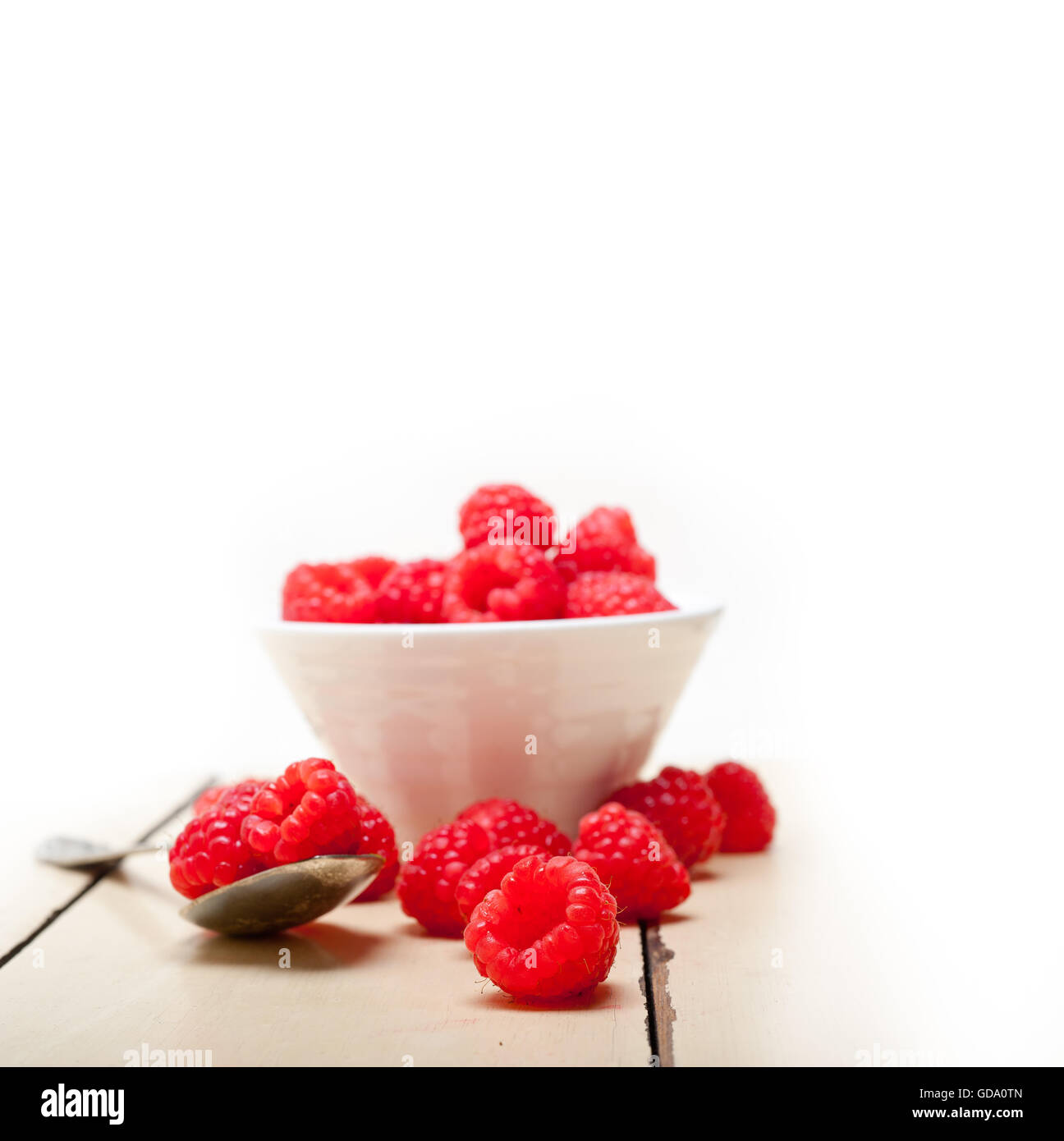 One Raspberry On A Table bunch of fresh raspberry on a bowl and white wood rustic table Stock ...