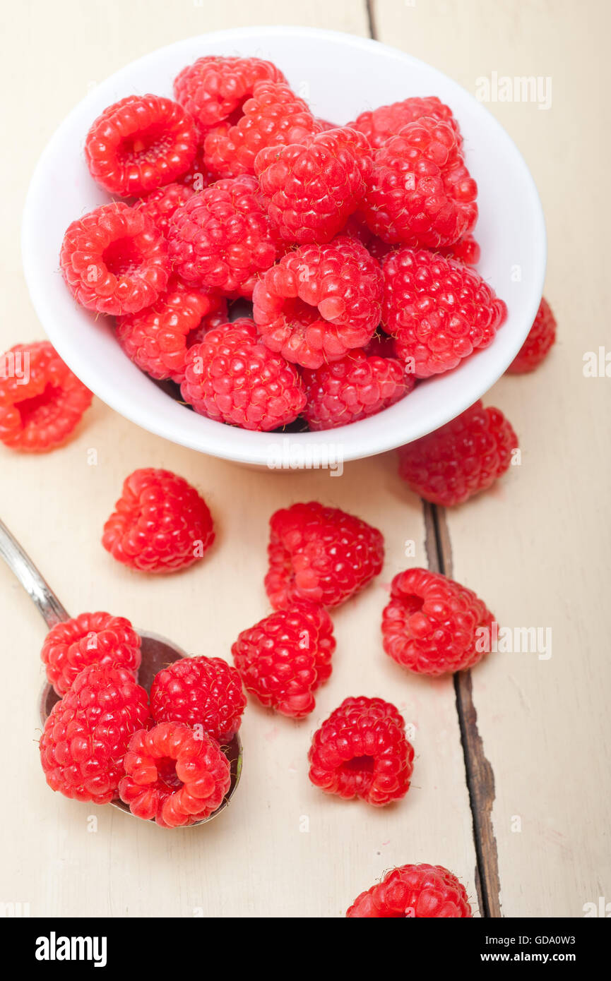 One Raspberry On A Table bunch of fresh raspberry on a bowl and white wood rustic table Stock ...