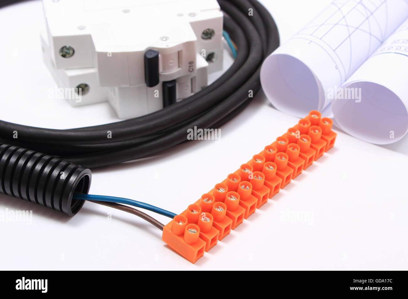Electrical cable with connection block, electric fuse and rolls of