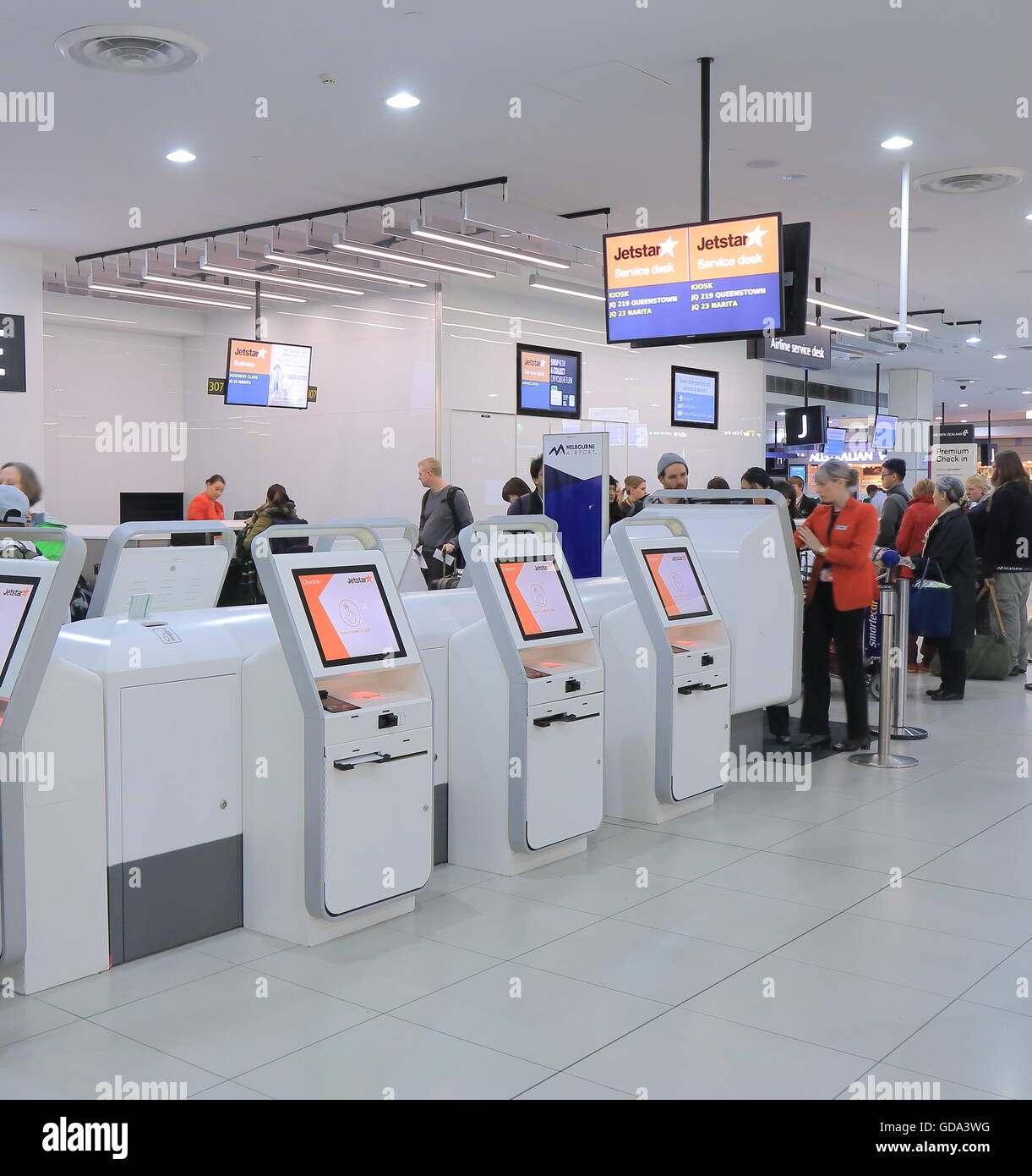 People check in at Jetstar check in counter at Melbourne airport Australia Stock Photo