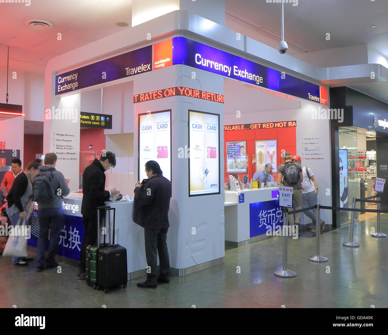 People exchange money at Travelex Melbourne Airport Australia Stock Photo