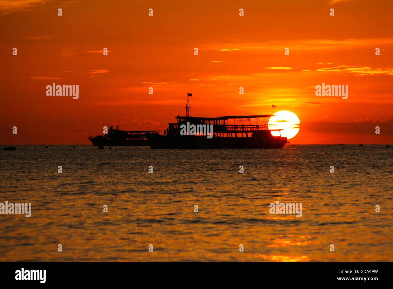 sunset on the beach with fishing boat in Pattaya, Thailand Stock Photo ...