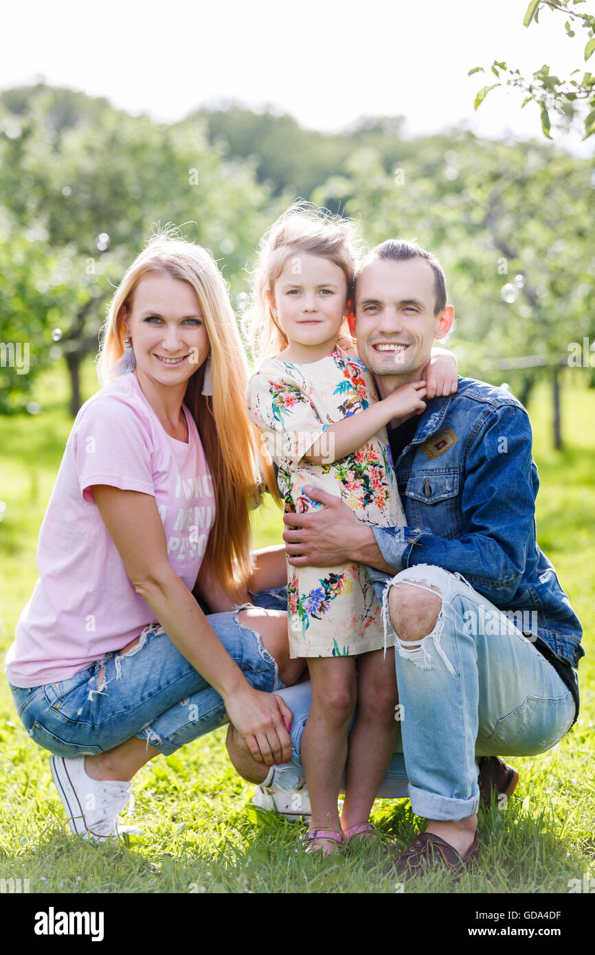 Family playing in the park Stock Photo - Alamy