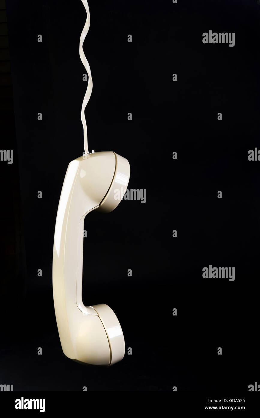 Telephone hanging on cord with room for your type Stock Photo Alamy