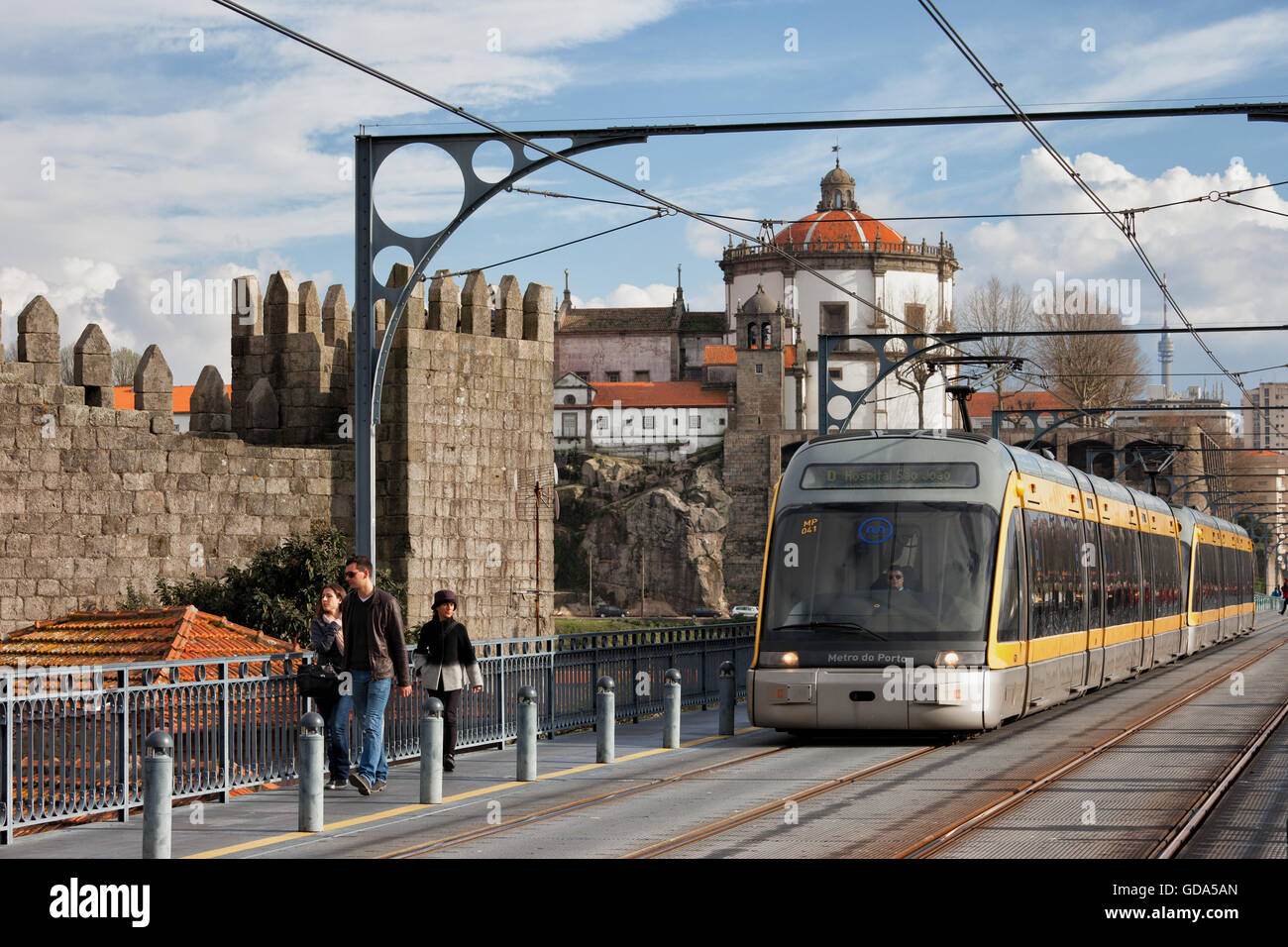 Metro public transport going from city of Vila Nova de Gaia to Porto on Dom Luis I Bridge in Portugal, monastery Serra do Pilar Stock Photo