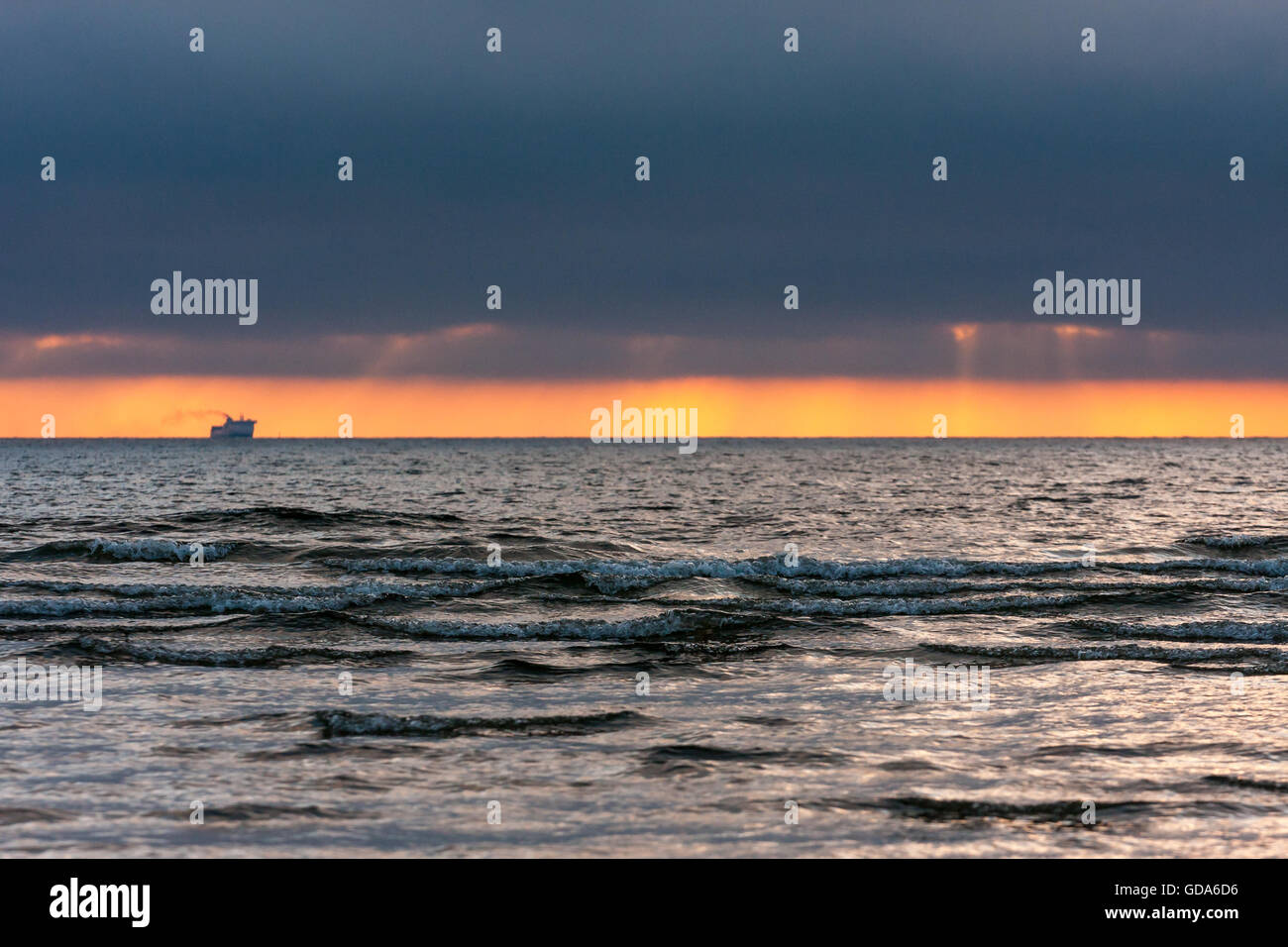 Sunset,the ship on the horizon Stock Photo - Alamy