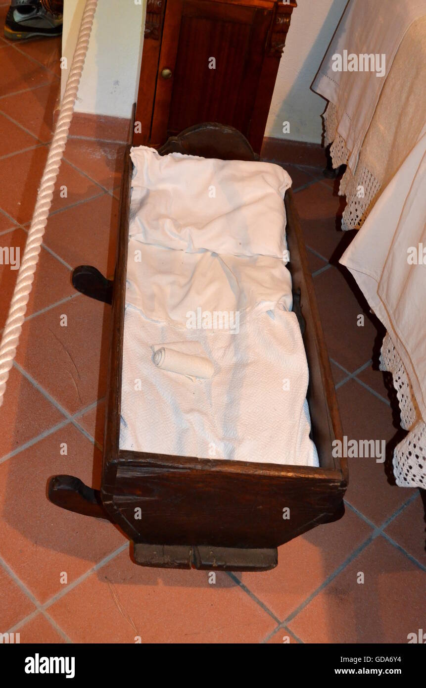Old vintage wooden cot with white sheet Stock Photo Alamy