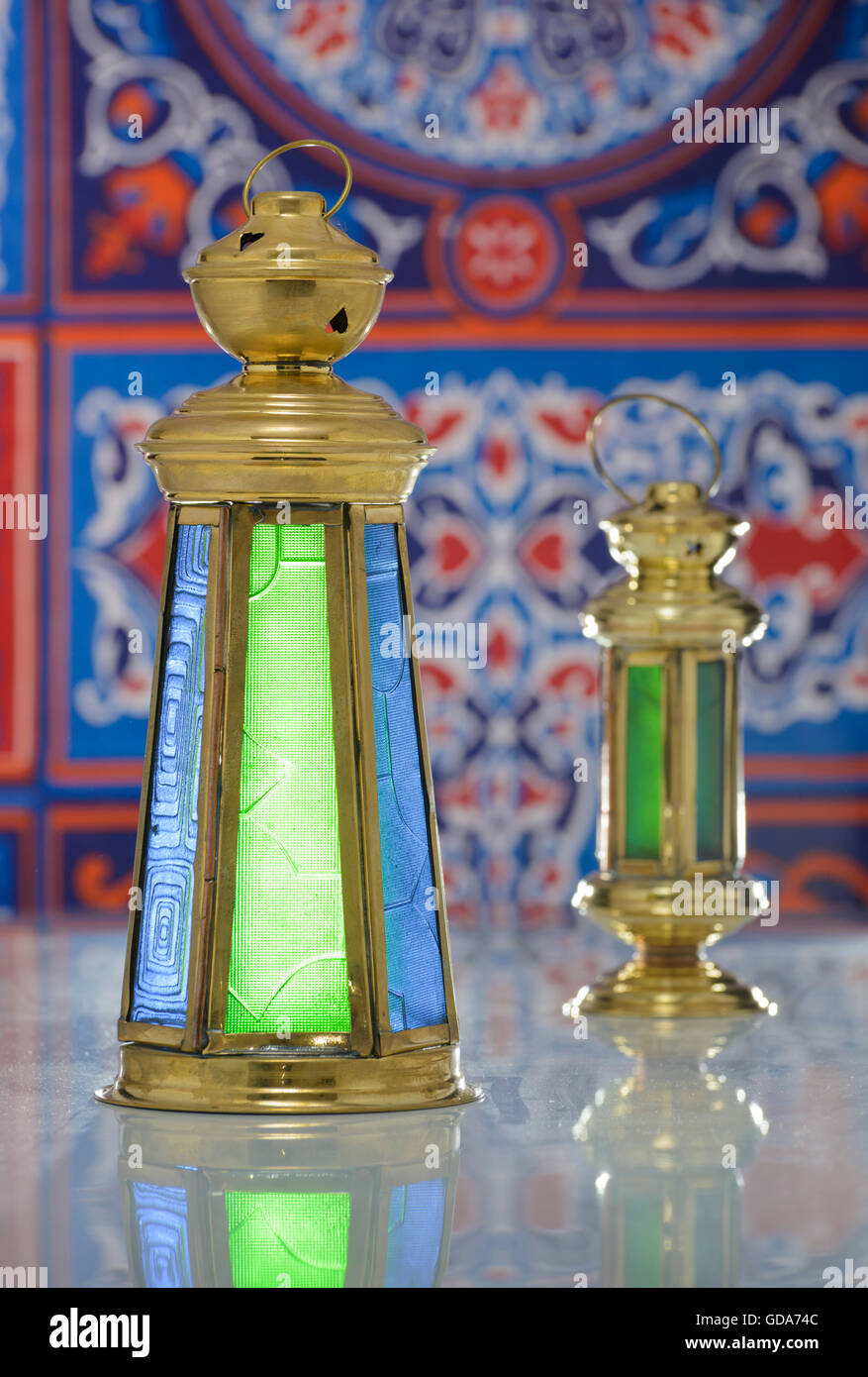 Group of Two Shiny Lanterns over Ramadan Fabric Stock Photo
