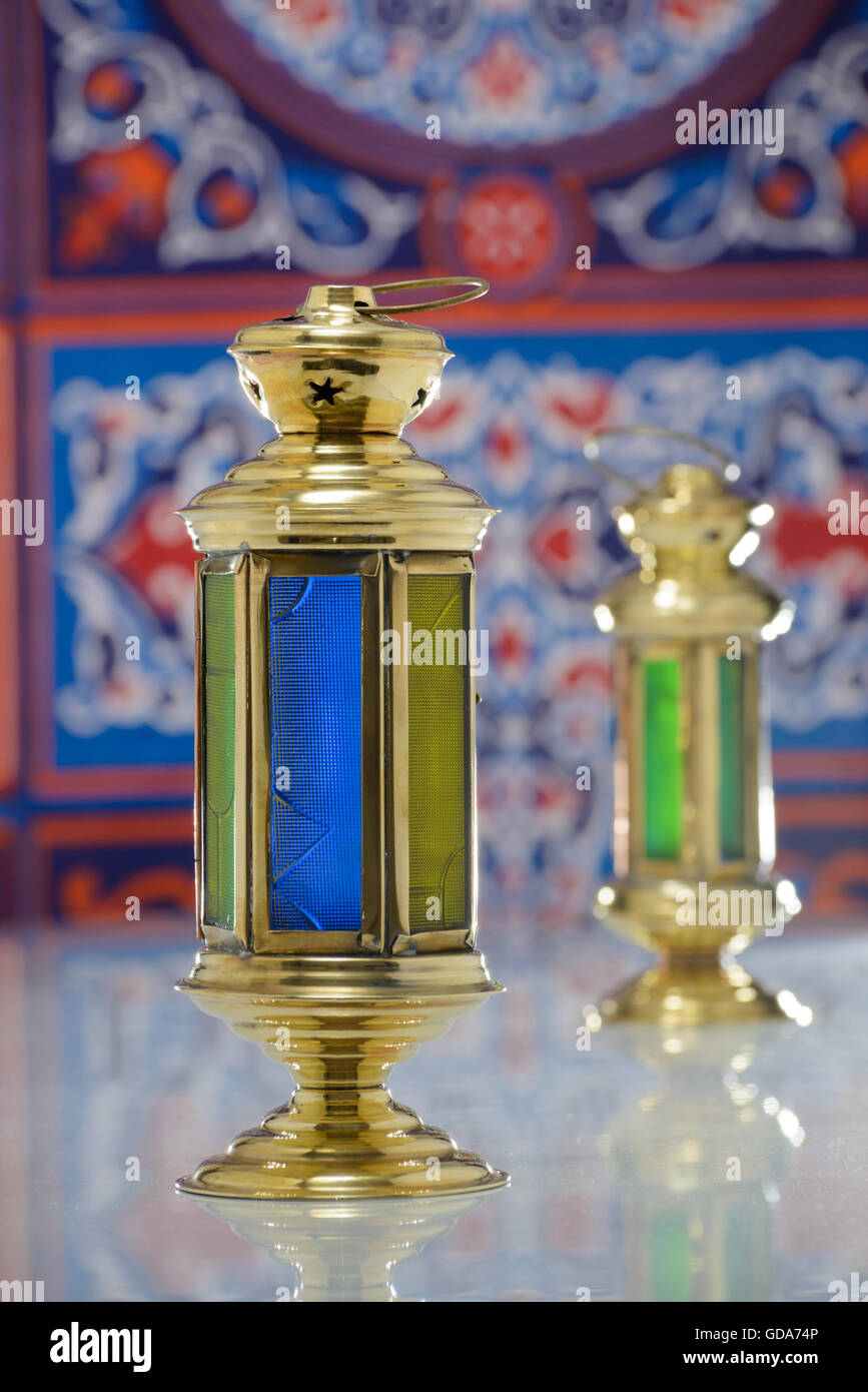 Group of Two Super Shiny Lanterns over Ramadan Fabric Stock Photo