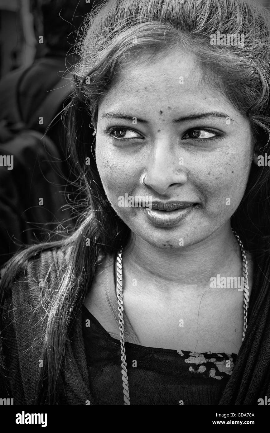 Portrait of Indian smiling lady on street in black and white Stock Photo