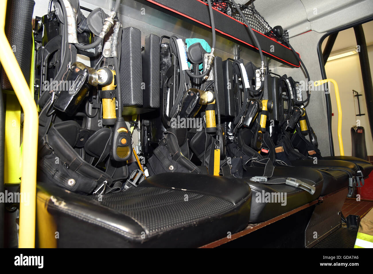 fire service. UK. Great Britain. rear of a fire engine showing firefighters gear ready to deploy Stock Photo