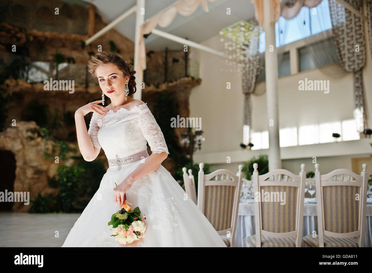 Portrait of beautiful bride at wedding hall Stock Photo - Alamy