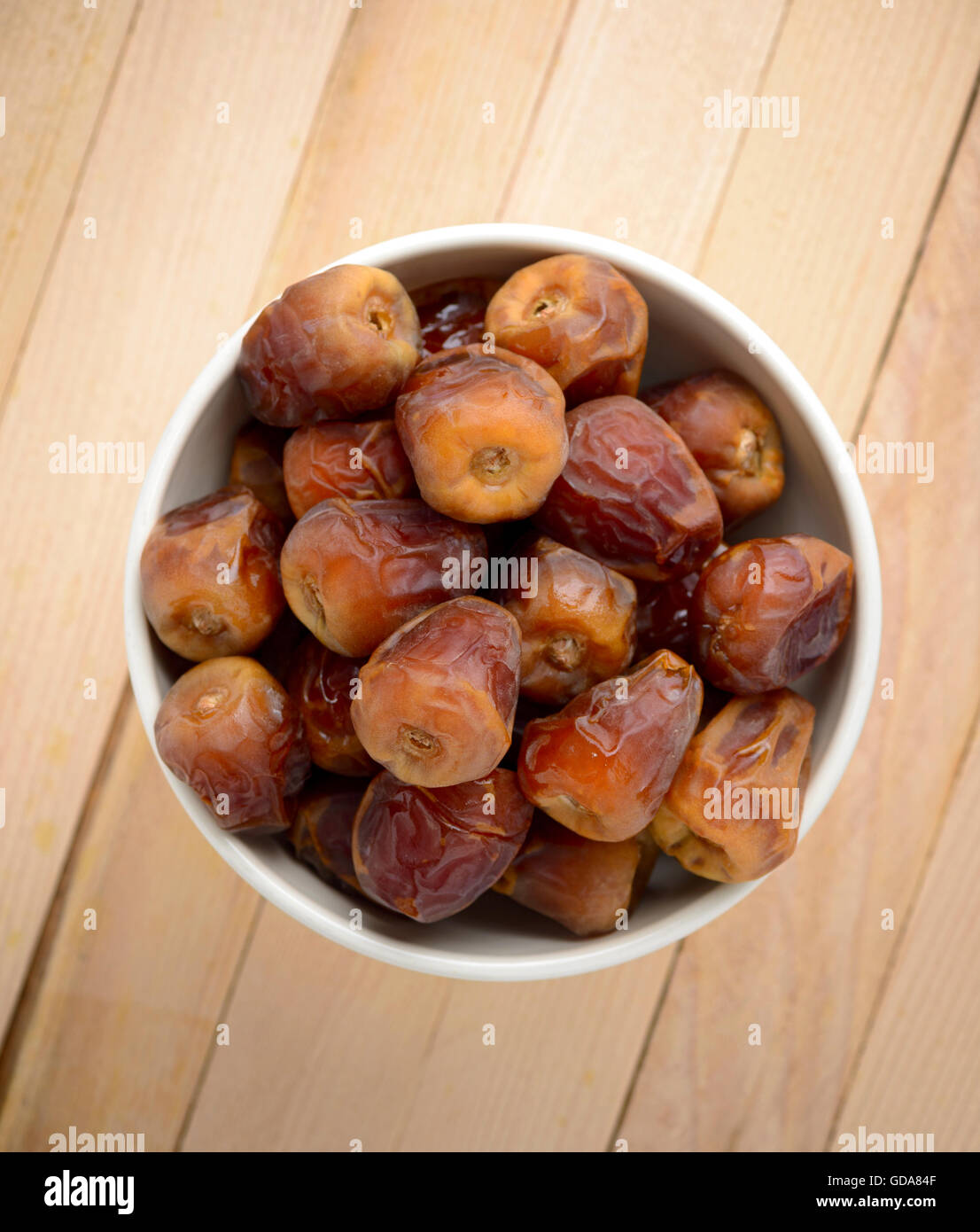 Ramadan Fasting Dates with Crescent over Wooden Table Stock Photo