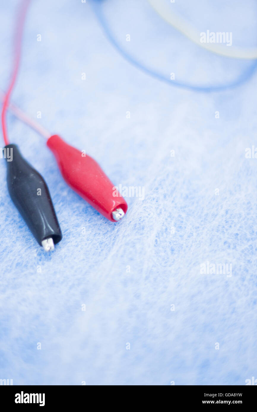 Dry needling electroacupunture cables connecting machine to needles used by acupunturist on