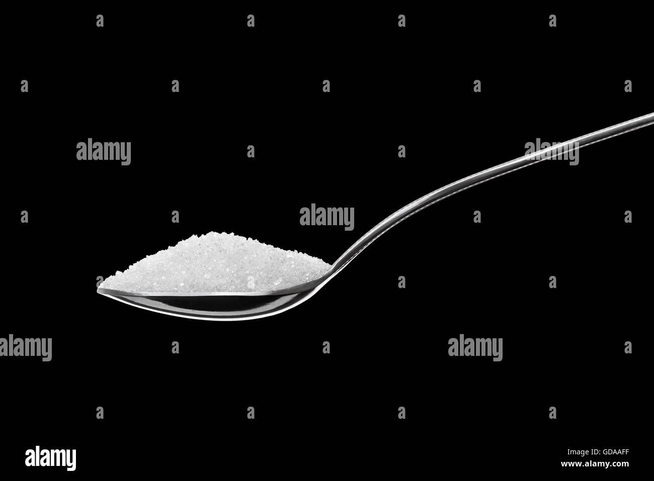 Spoon Full of Sugar Isolated on Black Background Stock Photo