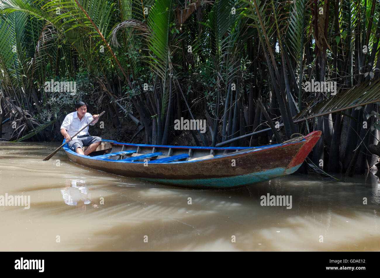 Vietnam, Can Tho, rower in wooden boat on the river Mekong Stock Photo ...