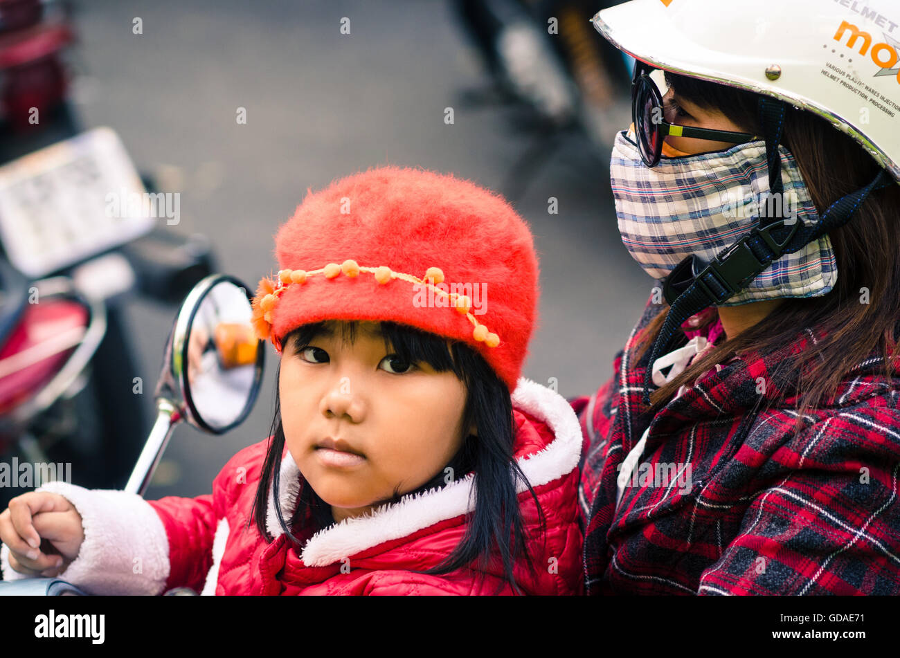 Vietnam, Quang Nam, Hoi An, Vietnamese girl with her mother on a scooter Stock Photo