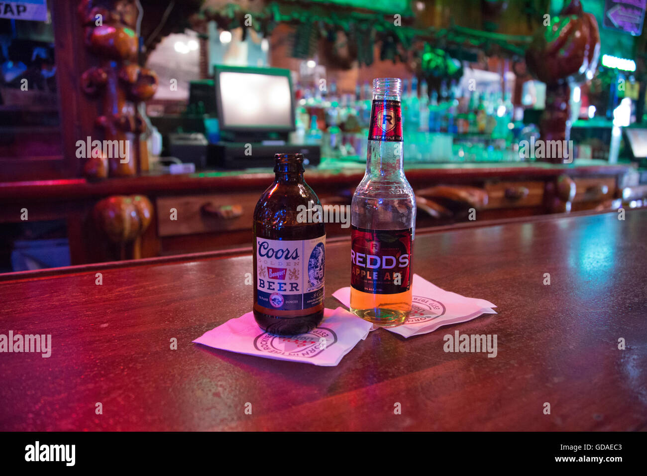 Coor's beer bottle and Ale bottle on bar counter in town of Sheridan  Wyoming USA Stock Photo