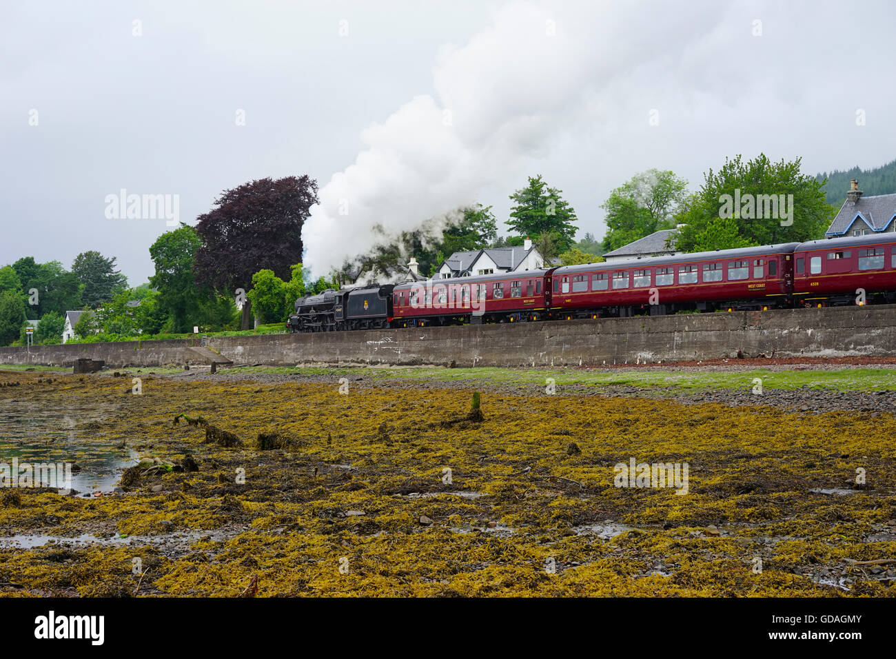 steam train going through Corpach,Fort William, Scotland, UK. Stock Photo