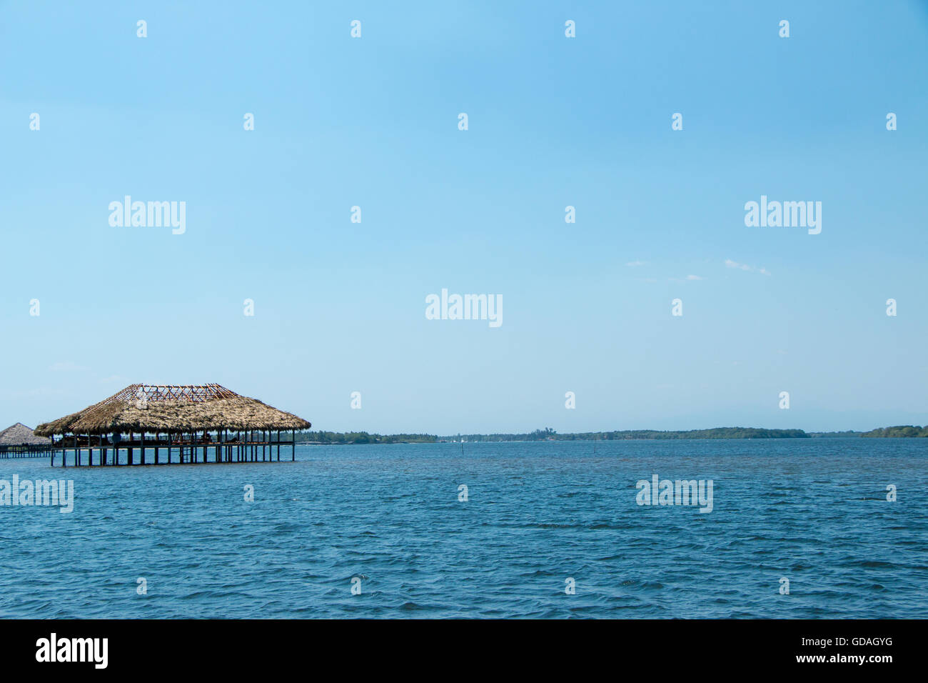 Several restaurantes in these huts over water near Cordoncillo at La Paz, El Salvador Stock Photo