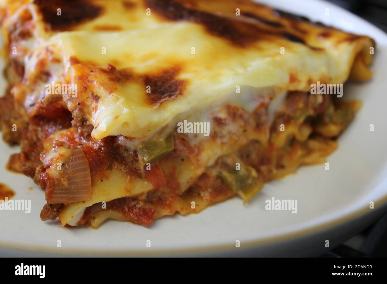 Homemade lasagne, home cooking, homemade cheese sauce, bolognese sauce,  mince, onions, peppers, garlic, Italian food Stock Photo - Alamy