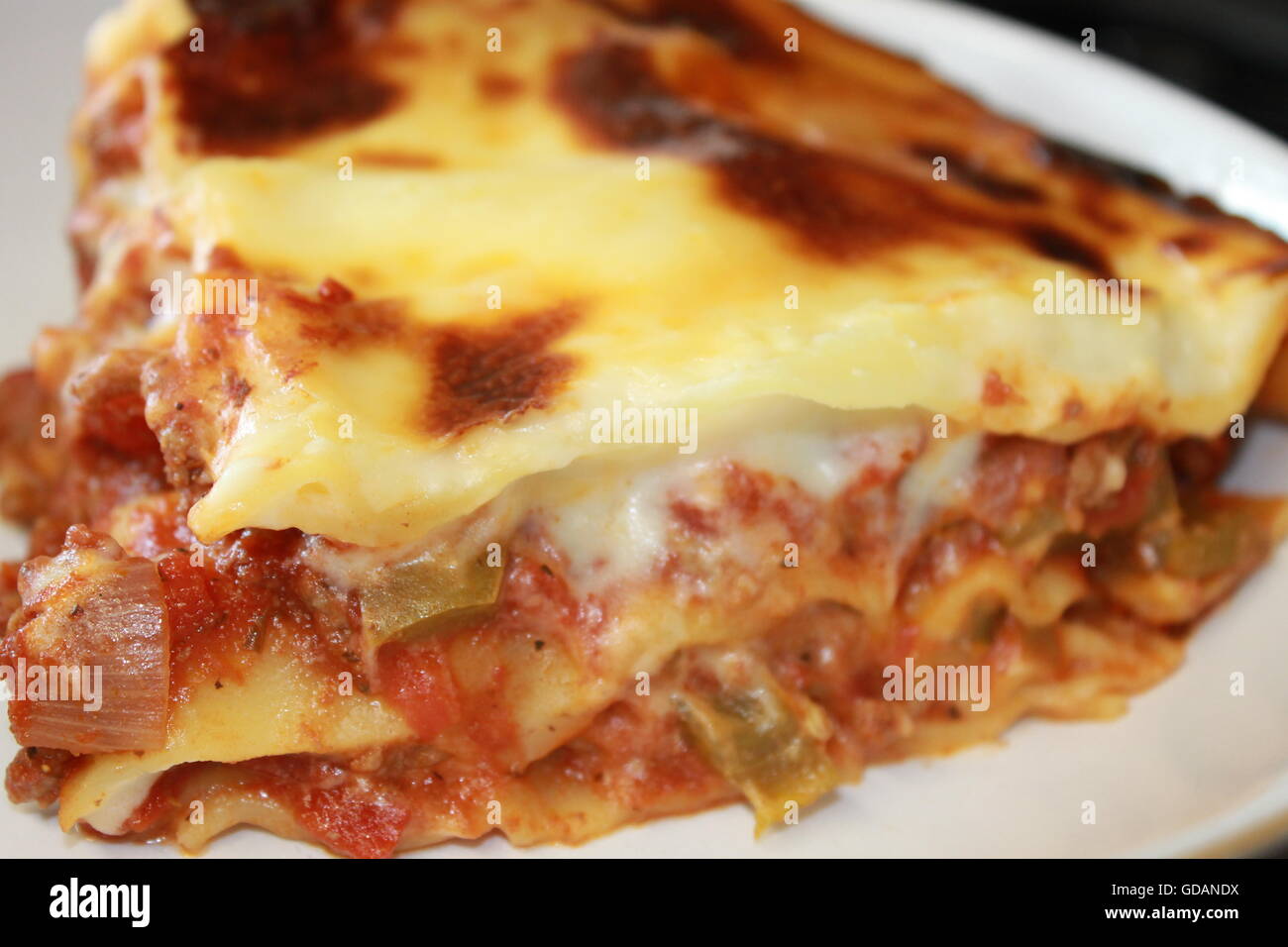 Homemade lasagne, home cooking, homemade cheese sauce, bolognese sauce, mince, onions, peppers, garlic, Italian food Stock Photo