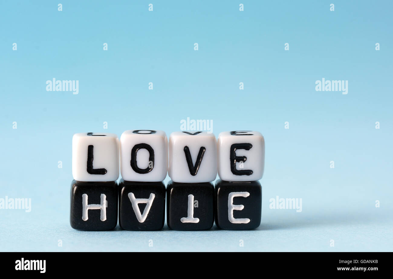 Love and Hate text concept on white and black dices Stock Photo - Alamy
