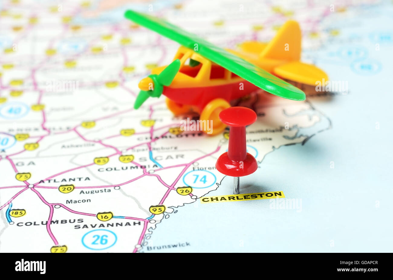 Close up of  Charleston  Carolina  USA  map with red pin and airplane toy - Travel concept Stock Photo