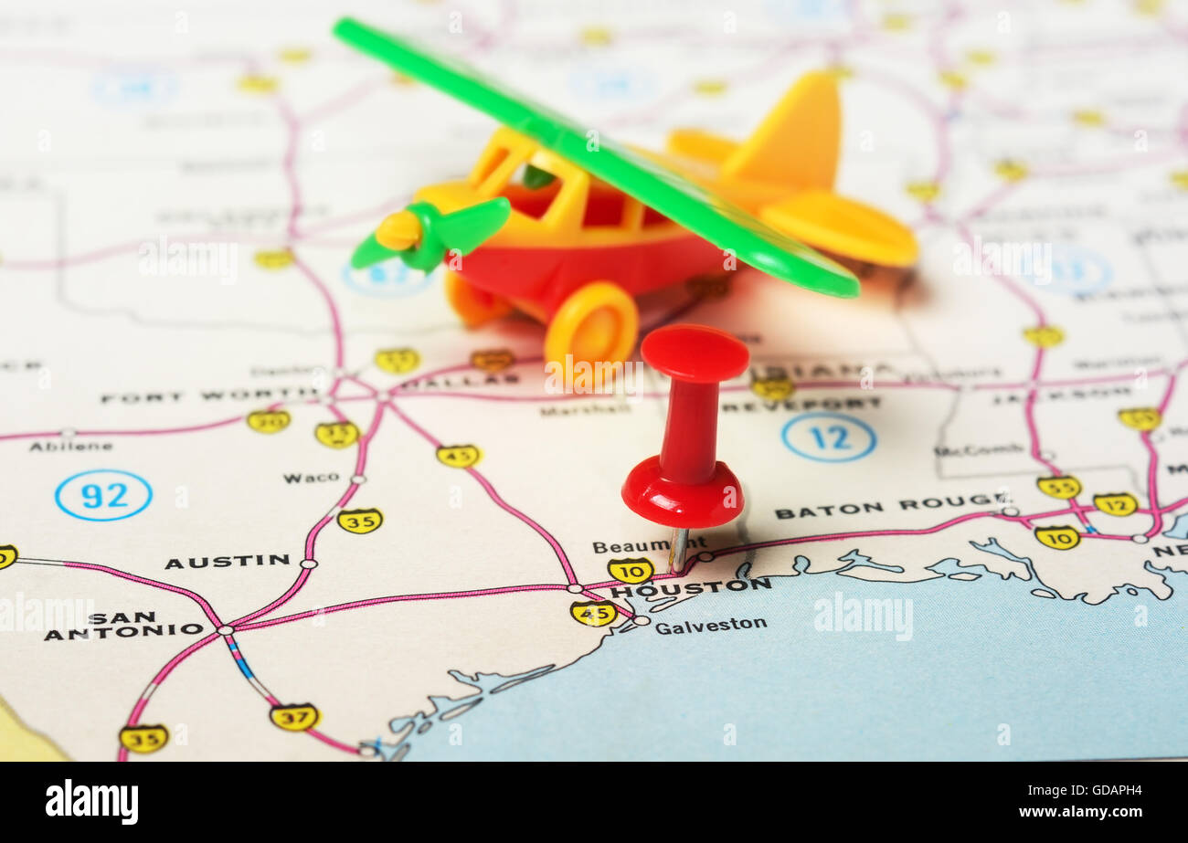Close up of Houston USA map with red pin and airplane toy- Travel ...