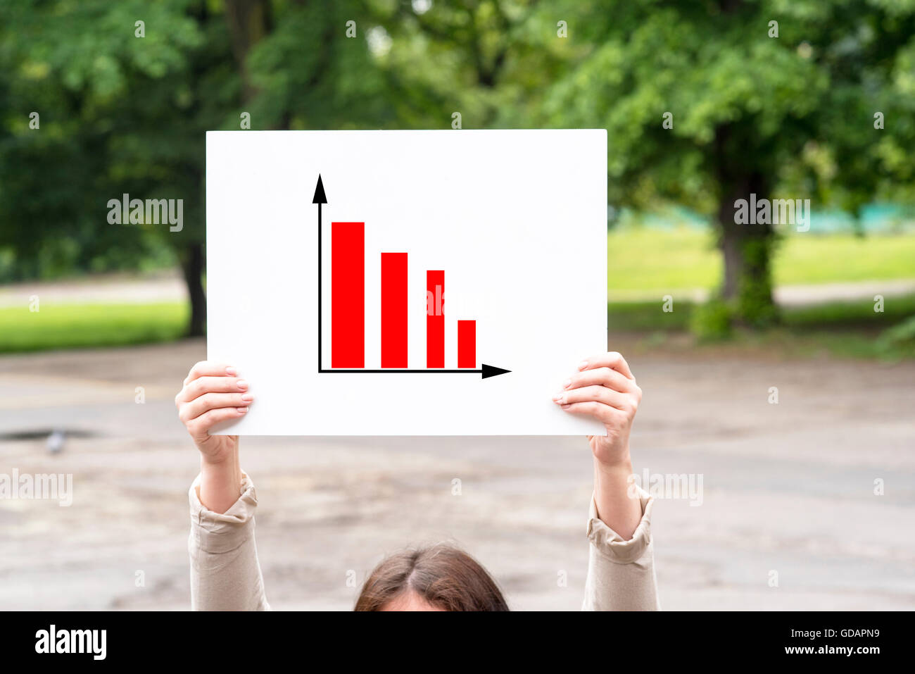 a picture of a woman presenting statistical reports and analysis charts ...