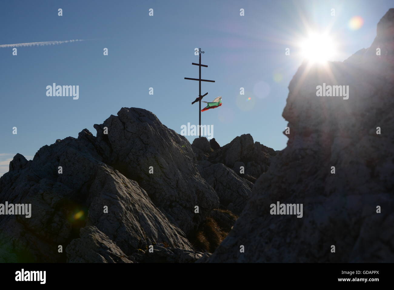 Bulgarian national flag tied  on a cross on mountain Stock Photo