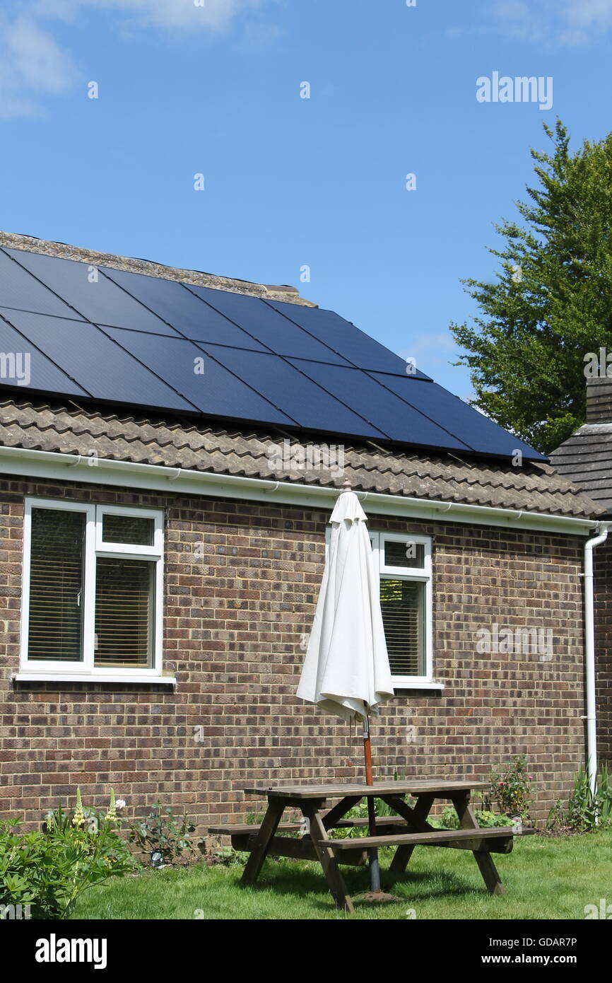 Solar panels, bungalow roof, solar energy, Four Marks, Hampshire Stock