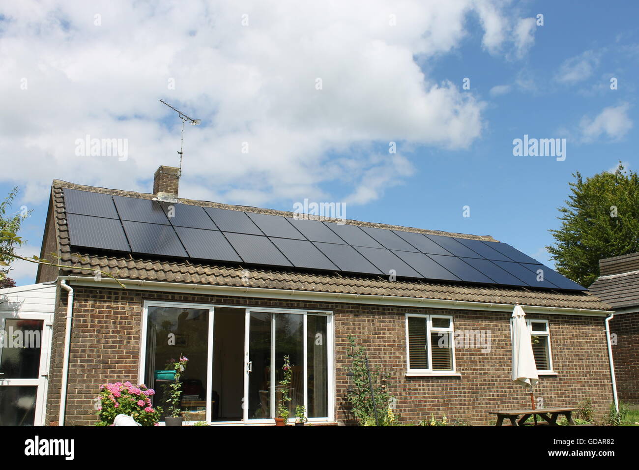 Solar panels, bungalow roof, solar energy, Four Marks, Hampshire Stock