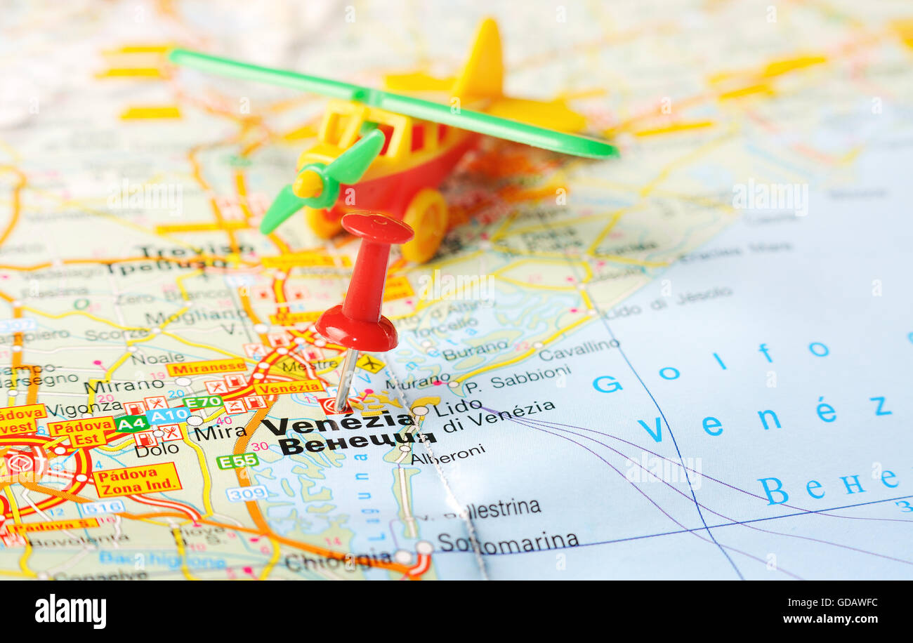 Close up of Venice , Italy map with red pin and airplane Travel