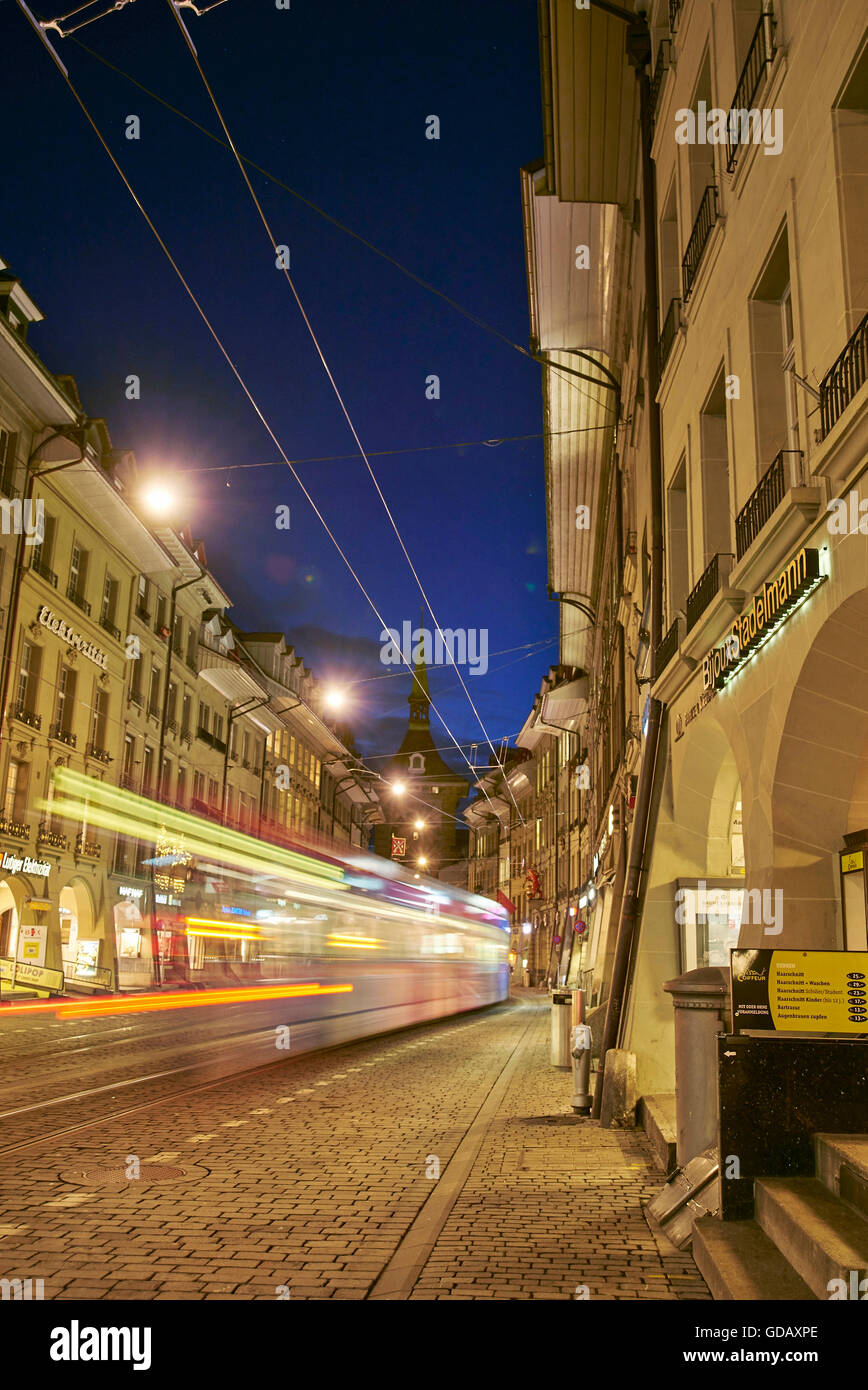 Bern,town,city,Switzerland,Europe,lights,traffic,dusk,twilight,blue hour,cars,automobiles,tram,streetcar,real esta Stock Photo