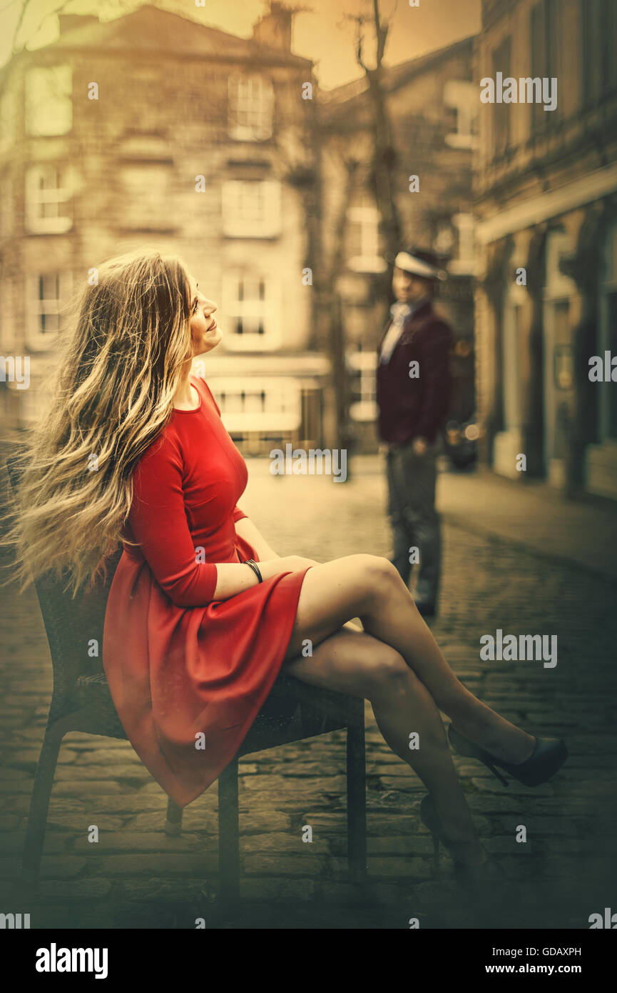 Woman dress sitting chair hi-res stock photography and images - Alamy