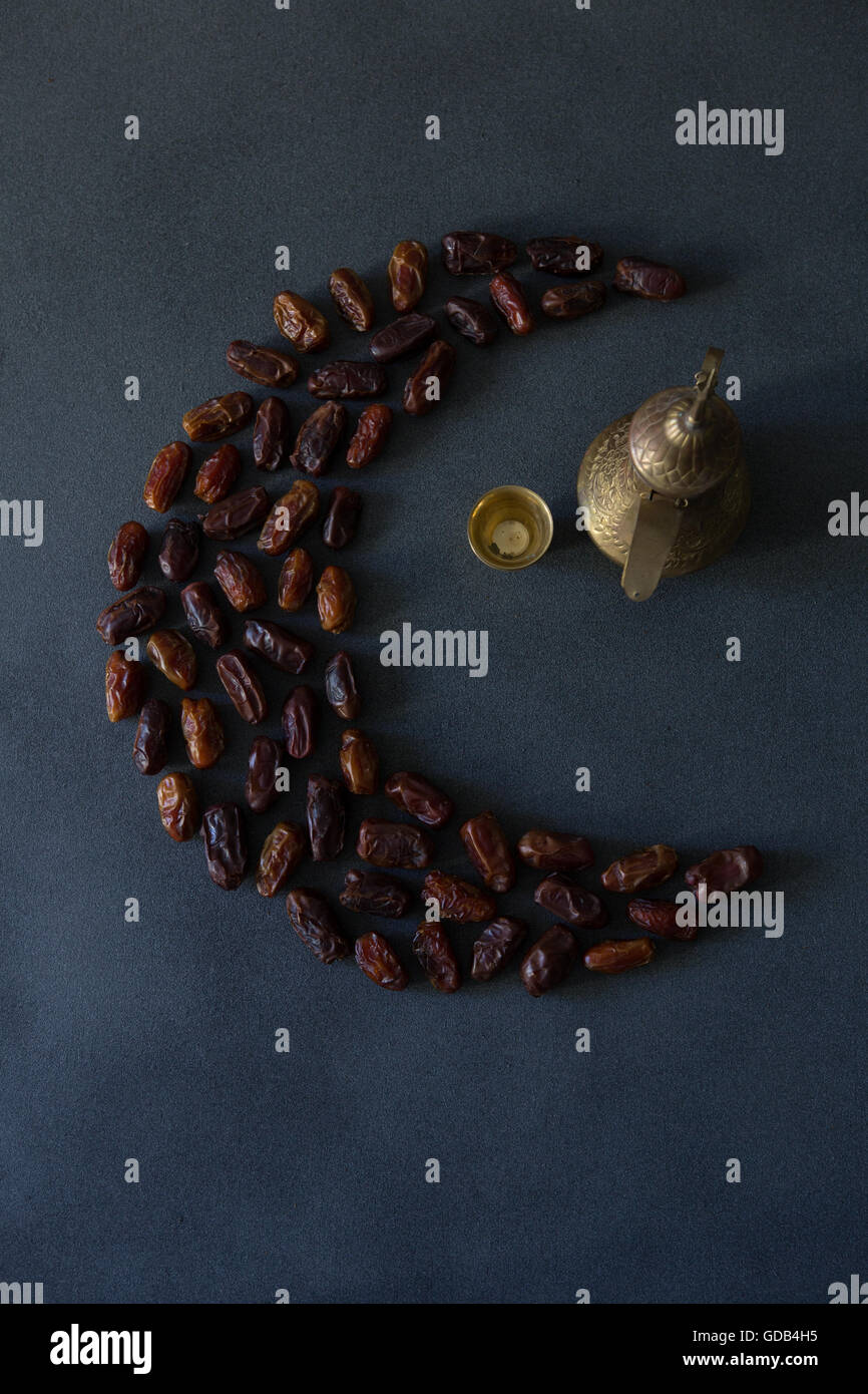 Dates in the shape of a crescent moon, a symbol of Ramadan in Islam, a ...